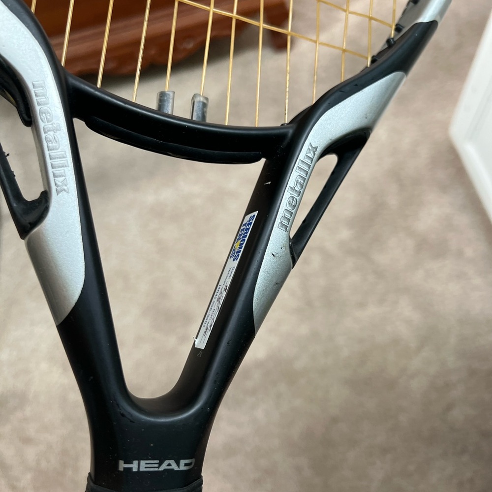 Used head metallix tennis racket- has scratches